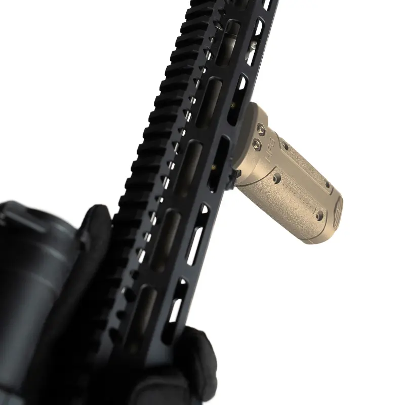 Close-up of Hera Arms HFG vertical grip in Flat Dark Earth showing textured grip surface and battery storage compartment for AR-15 rifles